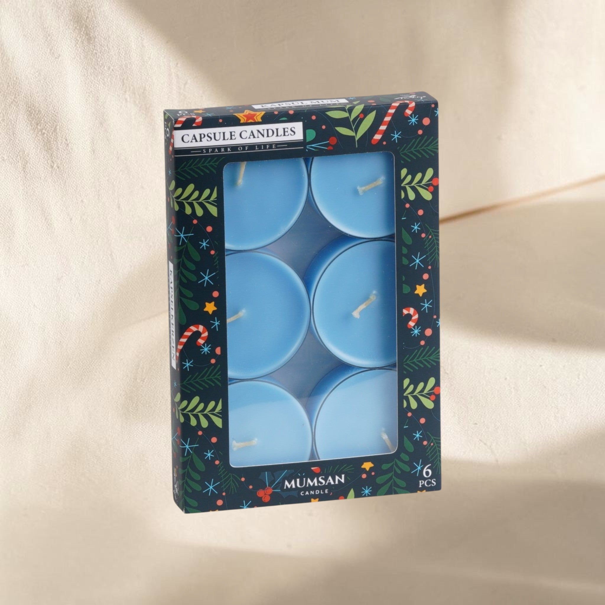 MUMSAN CANDLE 6'lı şeffaf maxi tealight kokulu mum seti, açık mavi renkte, her biri 42 gr ağırlığında ve 8 saat yanma süreli.