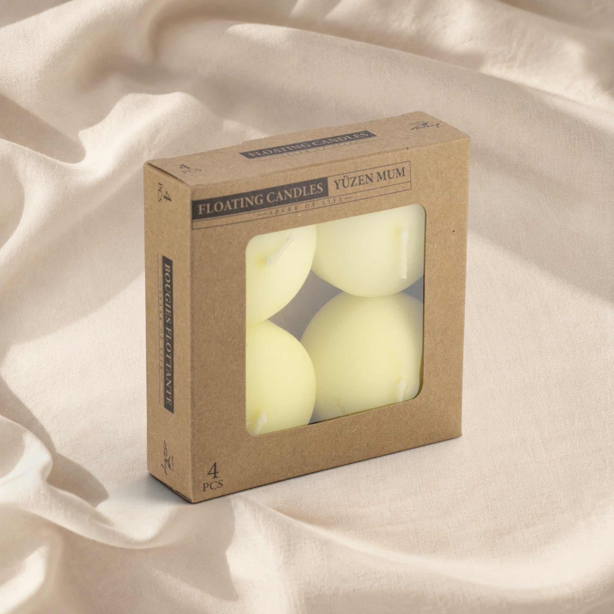 MUMSAN CANDLE 4'lü kraft kutuda krem rengi yüzen mum seti, dekoratif ve uzun yanma süreli.