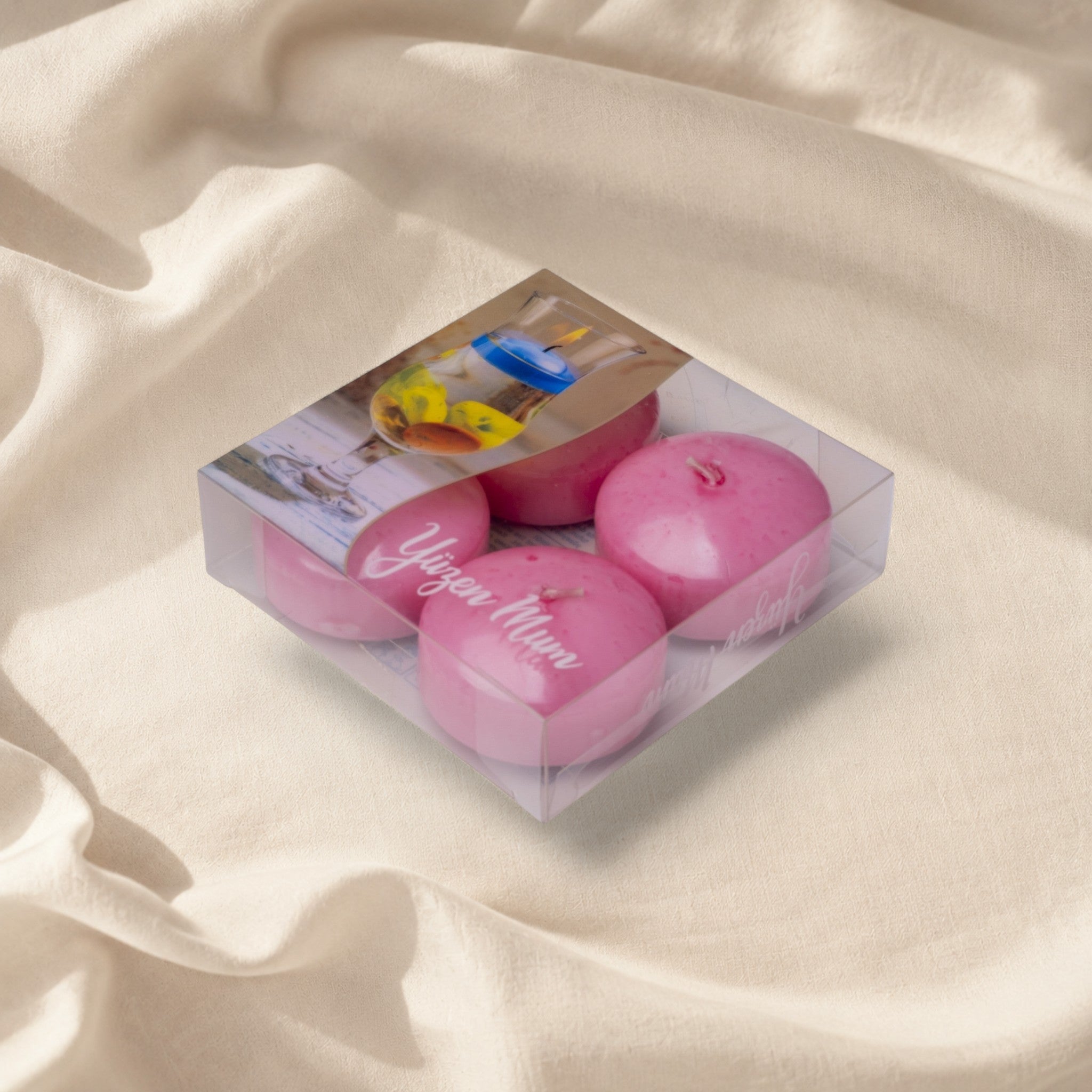 MUMSAN CANDLE 4'lü pembe yüzen mum seti, parafin malzemeden, 5 cm çapında, 4-5 saat yanma süreli, özel günler ve dekorasyon için ideal.